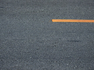 Poster - texture of asphalt road with yellow line