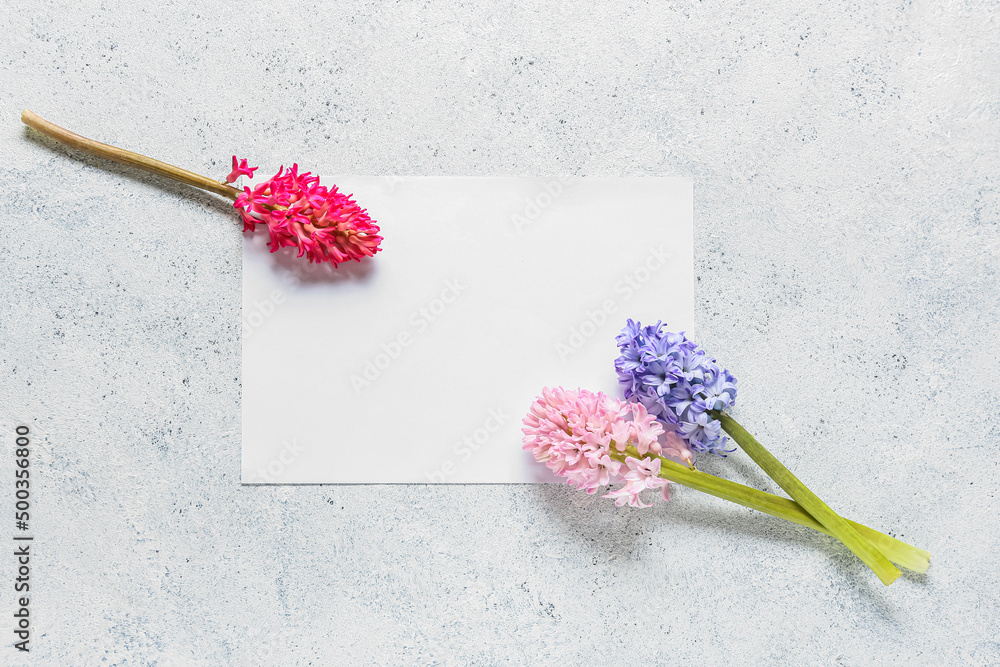 Blank card with beautiful hyacinth flowers on light background