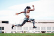 © santypan - Young African-American athlete sprinter jumping