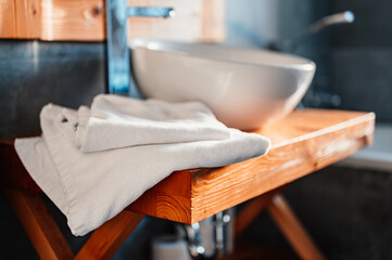 Wall Mural - Beautiful white folded towels placed on a table for spa use.