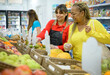 © Gabriel Trujillo - Cheerful ethnic women choosing products in supermarket