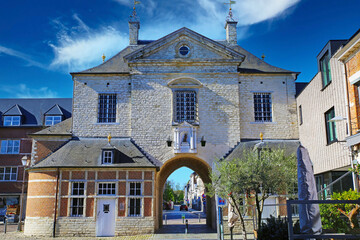 Wall Mural - Lier (Gevangenenpoort), Belgium - April 9. 2022: View on medieval city prison gate with brick facade, 17th century classicism classical architecture style, blue sky