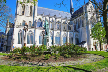 Wall Mural - Lier (Sint Gummaruskerk), Belgium - April 9. 2022: View on brabant gothic style roman catholic church from 15th century against blue sky