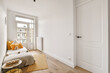 © ADDICTIVE STOCK - Bed near window in bedroom