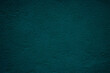 Petrol colored wall background with textures of different shades of teal