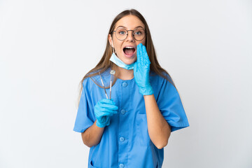 Lithuanian woman dentist holding tools over isolated background with surprise and shocked facial expression