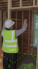 Wall Mural - animation of statistics processing over male engineer measuring at construction site