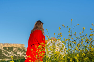 Poster - Girl in a field with flowers