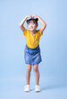 © Timeimage - Image of Asian child posing on blue background