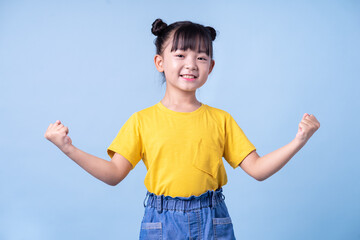 Image of Asian child posing on blue background