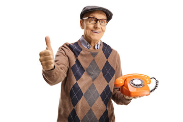 Poster - Elderly man holding an old vintage rotary phone and showing thumbs up