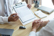 © snowing12 - Insurance concept the auto dealer emphasizing on the agreement of the contract for his client