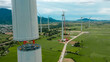 © Phuc - Aerial view of wind turbine under construction with a crane to generate sustainable alternative energy to reduce global warming and climate change. Sustainable growth.