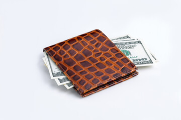 Wall Mural - One hundred dollar american banknotes in a leather wallet isolated on a white background. Close-up. Has a clipping path saved.