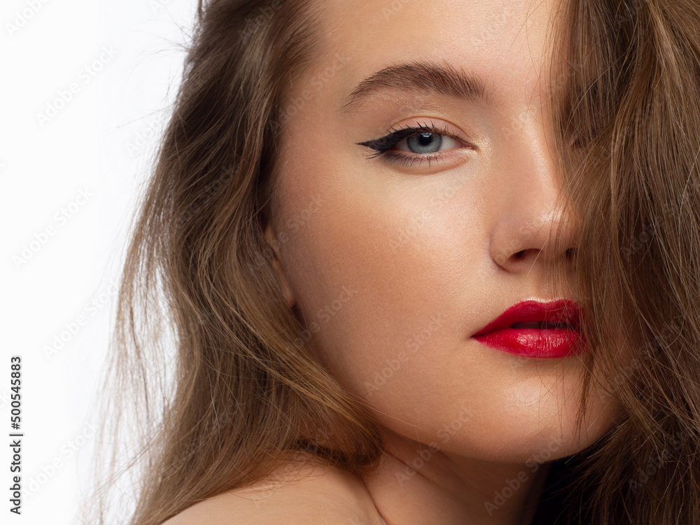 Close up portrait of a beautiful young female face with red lips and ...