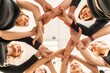 © svetograph - Team of people holding hands. Group of happy young women holding hands. Bottom view, low angle shot of human hands. Friendship and unity concept