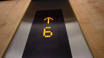 Movement of elevator up. The LCD screen shows countdown from one to thirty-six floors. elevator screen counts from 1 to 36. elevator cabin inside rises up. the interior of the elevator in the hotel.
