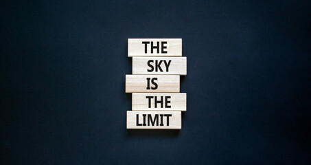 Wall Mural - Sky is limit symbol. Concept words The sky is the limit on wooden blocks. Beautiful black table black background. Business motivational stress spice of life concept. Copy space.