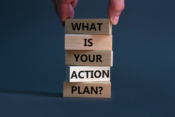 Wall Mural - Action plan symbol. Concept words What is your action plan on wooden blocks. Businessman hand. Beautiful orange table orange background. Business What is your action plan concept. Copy space.