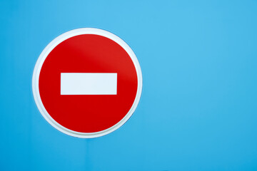 Stop road sign on blue isolated background