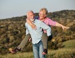 © Lumos sp - woman man outdoor senior couple happy lifestyle retirement together smiling love piggyback active mature