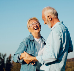 Wall Mural - woman man outdoor senior couple happy lifestyle retirement together smiling love old nature mature