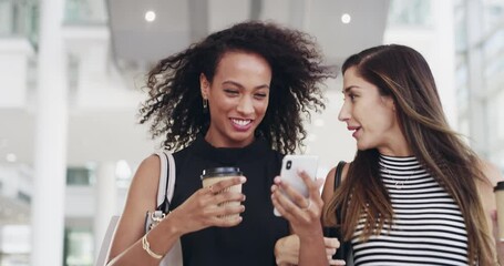 Poster - Surround yourself with success minded people. 4k video footage of young businesswomen chatting and using a smartphone while walking in an office on a coffee break.