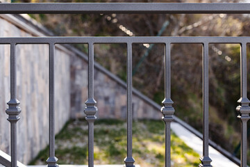 Modern metal railings and handrails in the loft style. The metal is treated with a primer and anti-corrosion paint. Interior design in industrial style.