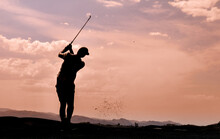 Silhouette Of A Golfer In Mid Swing