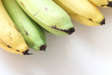 1 combed banana on a white background.