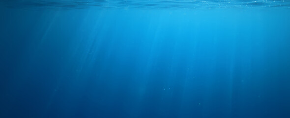 Wall Mural - ocean underwater rays of light background, under blue water sunlight