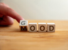 Have Good Mood Concept. Hand Flips Letter On Wooden Cube Changing The Word Mood To Good.