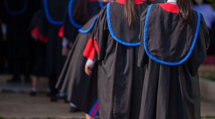 graduation ceremony of students Wearing Mortarboard at graduation ceremony from behind