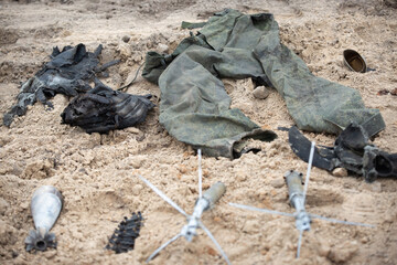 Sticker - Burnt uniforms of dead tankers at the site of recent fighting between the Russian and Ukrainian armies in Kyiv region, Ukraine