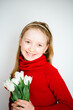 © Анна Молько - beautiful little girl in a red sweater on a white background with a bouquet of tulips. congratulations on mother's day