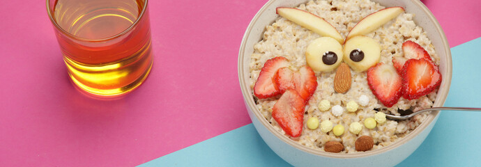 Poster - Creative oatmeal breakfast for kids on colourfull background.