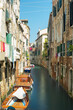 Small canal and old houses in Venice Italy