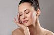 © verona_studio - Skin Care. Woman With Beauty Face Touching Healthy Facial Skin Portrait. Beautiful Smiling Girl Model With Natural Makeup Touching Her Skin.