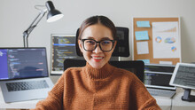Portrait Young Asian Woman Developer Programmer, Software Engineer, IT Support, Wearing Glasses Look At Camera And Smile Enjoy Working At Home.