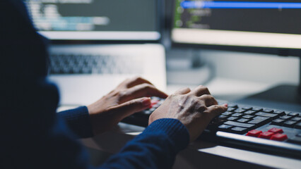 Closeup hand of developer programmer, soffware engineer, IT support, typing on computer keyboard