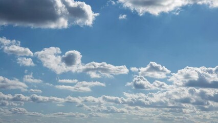Wall Mural - Timelapse of cumulus clouds with blue sky on a sunny day of summer. Beautiful cloudscape as nature background panorama. Wonderful weather of natural daylight with white cloud floating
