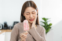 Health Asian Young Woman Touching Cheek, Expression, Suffering From Toothache, Decay Or Sensitivity Cavity Molar Tooth, Teeth Or Inflammation Eat Cold Ice Cream At Home. Sensitive Teeth People.