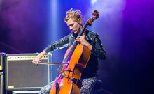 Young Woman Playing Cello On The Concert At Night