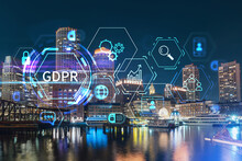City View Panorama Of Boston Harbour And Seaport Blvd At Night Time, Massachusetts. Building Exteriors Of Financial Downtown. GDPR Hologram Is Data Protection Regulation, Privacy For All Individuals