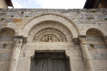 Medieval Vaulted Arch With Cross Above The Door Jamb In The Historic Village Of Monteriggioni