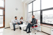 © Andrii - A young married couple came to an appointment and consultation with a psychotherapist. Counseling and help during depression and solving family problems. Communication with a psychologist.