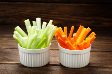 Wall Mural - Fresh vegetables - chopped celery sticks and carrots. Diet and healthy food.