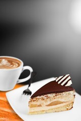 Sticker - Homemade chocolate cheesecake slice in white plate on cafe background