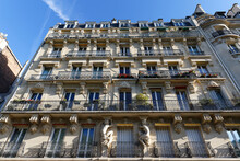 The Facade Of Traditional French House With Typical Balconies And Windows. Paris.