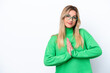 © luismolinero - Young Uruguayan woman isolated on white background keeps palm together. Person asks for something